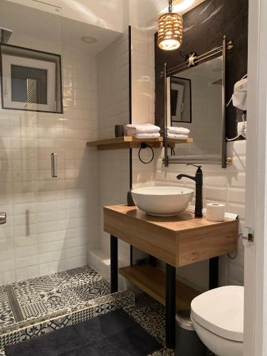 a bathroom with a sink and a toilet at The secret room in Alba Iulia
