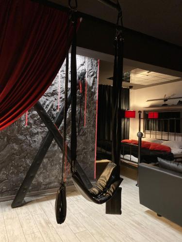a hanging hammock in a room with a bedroom at The secret room in Alba Iulia