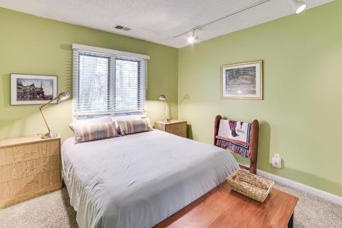 a bedroom with green walls and a bed and a window at Only 8/22-8/29 Still Available for Summer 2026! in Harbor Springs