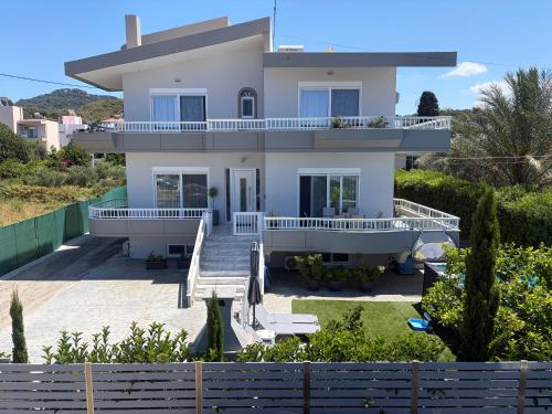 a villa with a view of a house at GianAngelo Holiday Villa in Kremasti