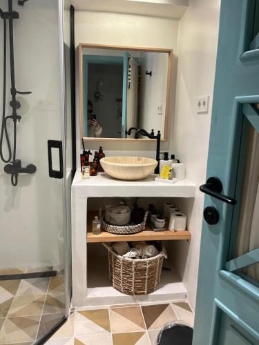 a bathroom with a sink and a mirror at Nunu HOUSE Urla in Urla