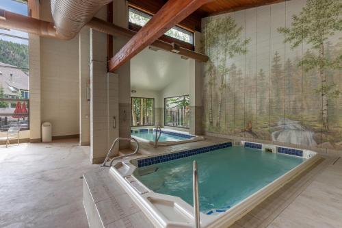 a large indoor swimming pool in a building with a swimming pool at Pines #2163 in Keystone