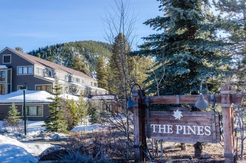 a sign for the pines in front of a house at Pines #2163 in Keystone