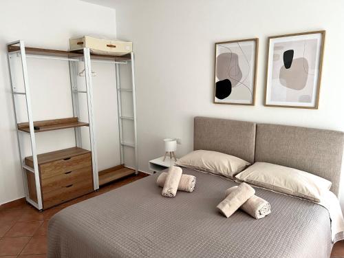 a bedroom with a bed with two pillows on it at Cascina Volpi in Montegrino Valtravaglia