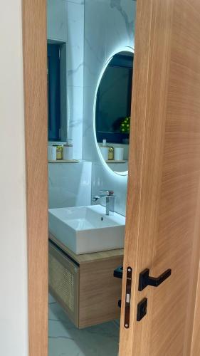 a bathroom with a sink and a mirror at Vila Kraljica Une in Bosanska Krupa