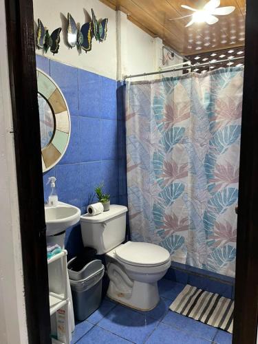 a bathroom with a toilet and a sink at Casa KAFRA in Hone Creek