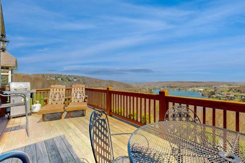 a balcony with a table and chairs and a view at Amazing Overlook in McHenry