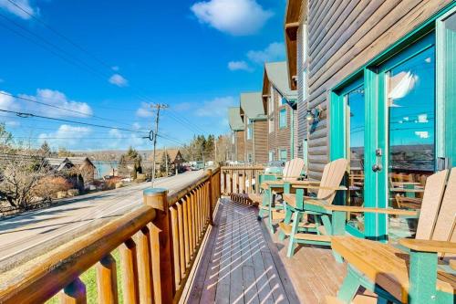 a deck with chairs and tables on a building at Cedar Shores #15 in McHenry