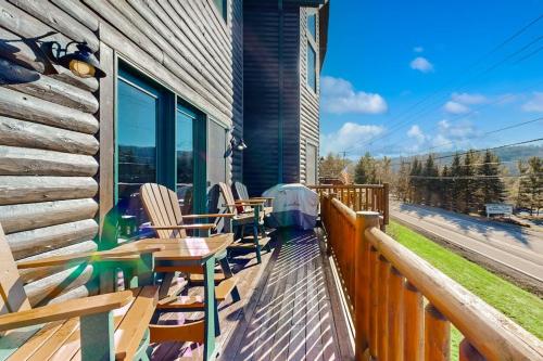 a deck with chairs and tables on a house at Cedar Shores #15 in McHenry