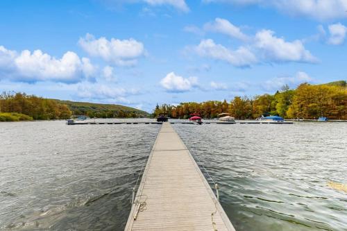 a dock on a lake with boats in the water at Ski Cove #2 in McHenry