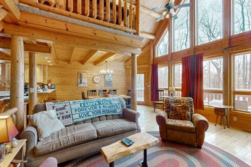 a living room with a couch and a table at 5 Little Acorns in McHenry