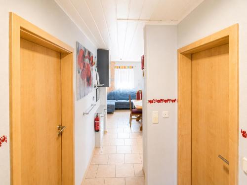 a hallway with two doors and a living room at Stadldorf» Ferienwohnung Wagner in Kirchroth