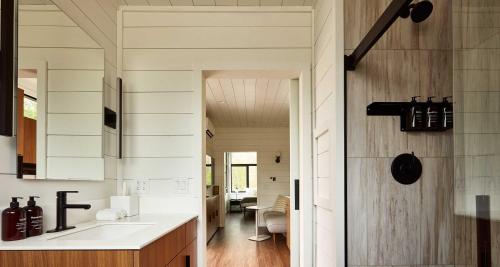 a kitchen with a white counter and a dining room at AutoCamp Asheville in Asheville