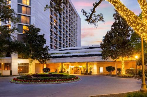 a rendering of the exterior of a hotel at Houston Grand Hotel - River Oaks in Houston