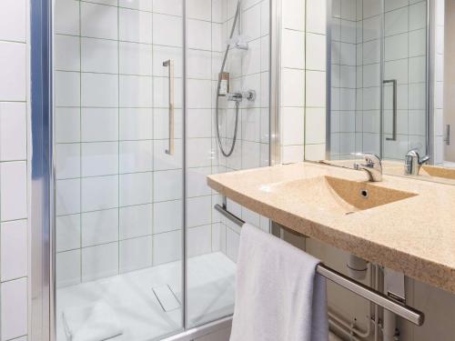 a bathroom with a shower and a sink at greet Chartres Est in Chartres