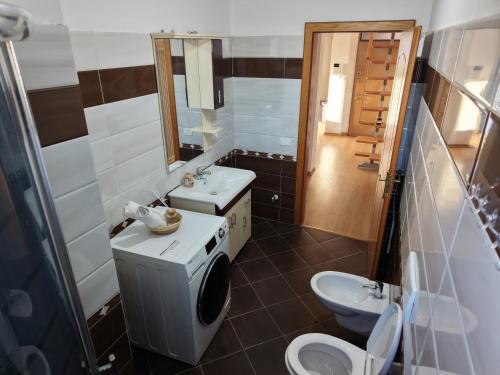 a bathroom with a sink and a toilet at Dua 1 Apartments Shkoder in Shkodër