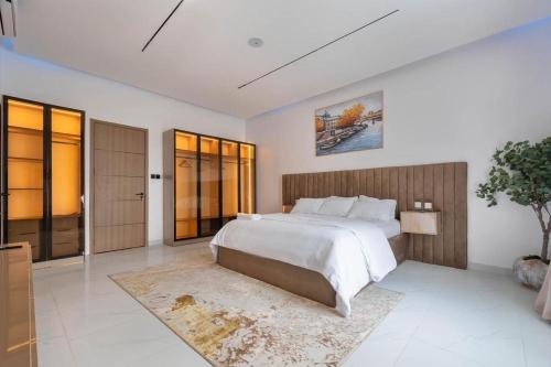 a large bedroom with a large bed and a large window at Lisa homes 2 3bedroom in Lekki