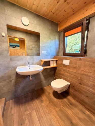 a bathroom with a sink and a toilet at ZEFIR Dąbki in Dąbki