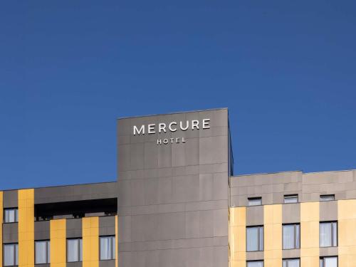 a sign on the side of a building at Mercure Prishtina City in Prishtinë