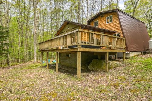 a large wooden house in the middle of a forest at Woodsy Way Cabin in Oakland