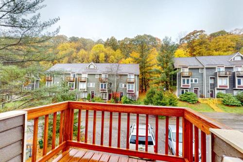 a wooden deck with a view of a house at Hibernation Hideaway in McHenry