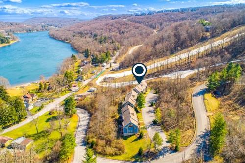 an aerial view of a train traveling along a river at Liftside Retreat in McHenry