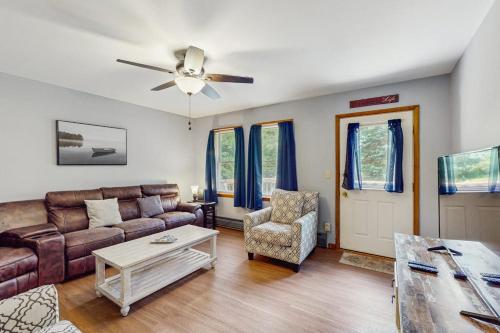 a living room with a couch and a table at All Spruced Up in Oakland
