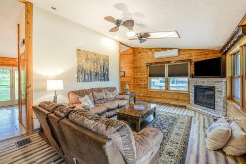 a living room with a couch and a fireplace at Gleanings Pond in McHenry