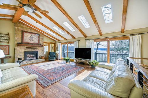a living room with a couch and a fireplace at A Million Dollar View in Oakland