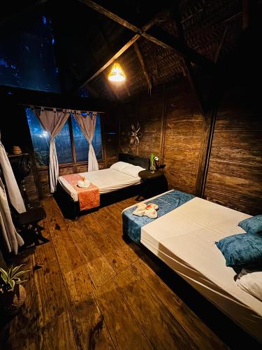 a bedroom with two beds in a room at Nawala Eco-hostel in Termales - agua caliente - nuqui
