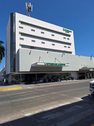 a large white building on the side of a street at Wyndham Garden Los Mochis Plaza Inn in Los Mochis