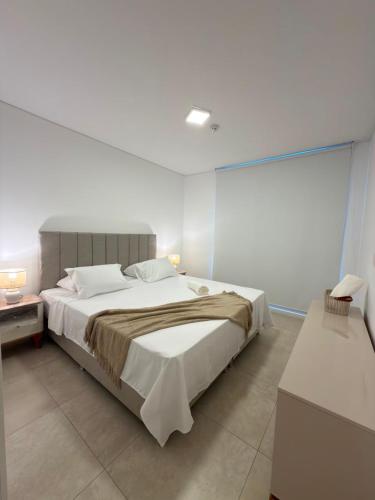 a bedroom with a large bed in a room at Feel Premiun 2401 in Asunción