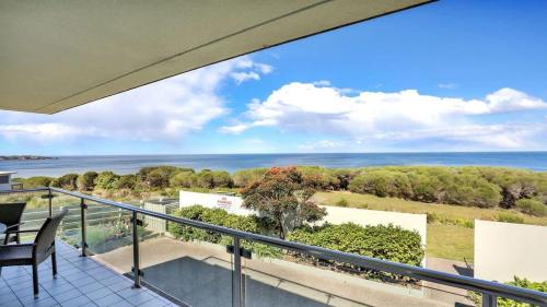 a balcony with a view of the ocean at Quarterdeck 3 in Tura Beach