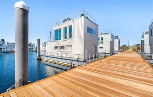 a dock with a house on top of the water at Seebär in Olpenitz