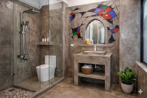a bathroom with a shower and a sink and a toilet at Phong Nha Midtown Hotel in Phong Nha