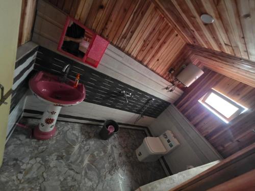 an overhead view of a bathroom with a red sink at BBASAN FARMs in Darjeeling