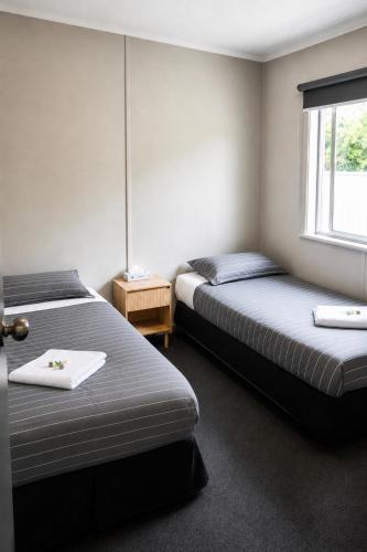 a room with two beds and a window at Warrack Motel in Warracknabeal