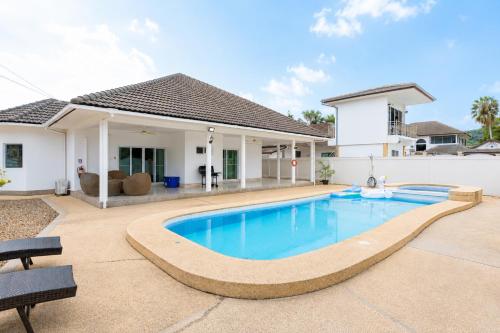 a swimming pool in the backyard of a house at D2 Private Pool Villa Snooker Family & Friends in Hua Hin