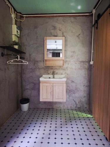 a bathroom with a sink and a mirror at NO name bangalow in Ko Lanta Yai