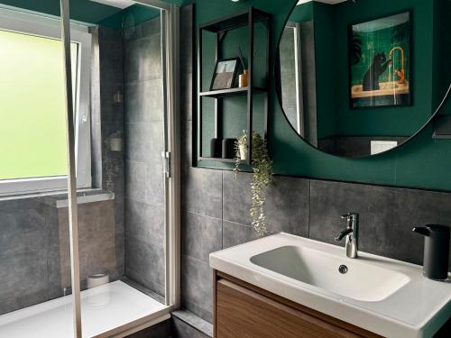 a bathroom with a sink and a mirror at Fewos Herrentor in Emden in Emden