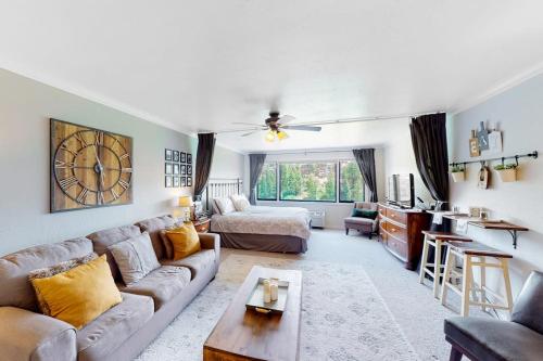 a living room with a couch and a bed at The Lodge at Tamarron #425 in Durango