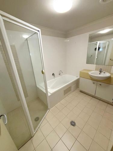 a bathroom with a shower and a sink at Jubilee Apartment 04 - Bring your own linen in South West Rocks