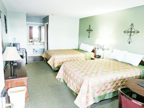 Ένα ή περισσότερα κρεβάτια σε δωμάτιο στο Hearthstone Inn