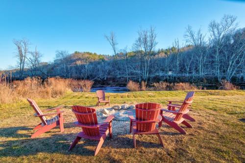 a group of chairs sitting around a fire pit at New River Ramble in Todd