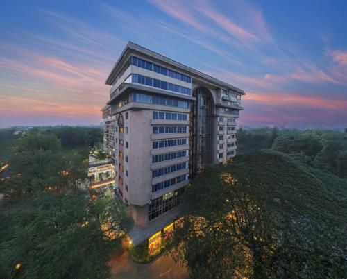 an overhead view of a tall building at dusk at Royal Orchid Central Bangalore, MG Road in Bangalore