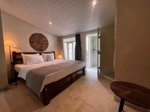 a bedroom with a large bed in a room at BnB by Month in Weligama