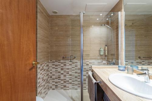 a bathroom with a shower and a sink at Maria apartment in Blanes