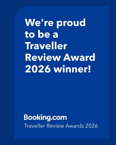 a blue sign that says were proud to be a traveler review award winner at Casa Duomo Luxury Suites in Monza