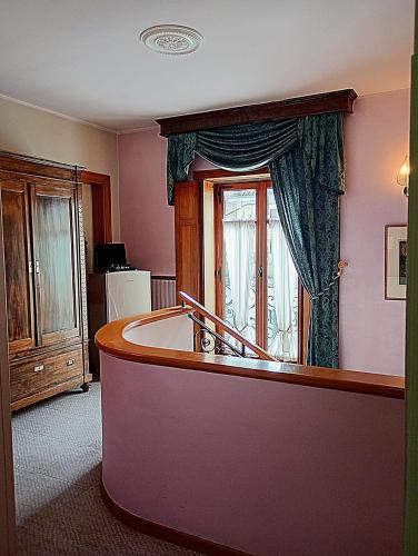 a kitchen with a tub and a window at Vibo In Centro in Vibo Valentia