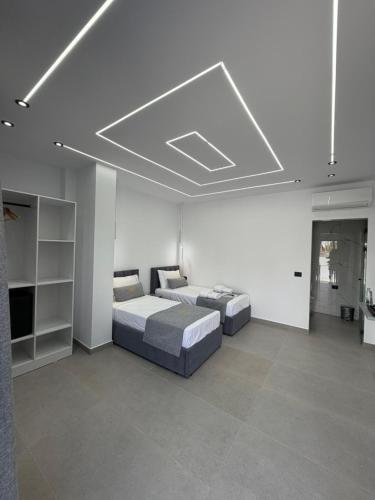 a bedroom with two beds in a room with at Grand Avelor Hotel in Vlorë